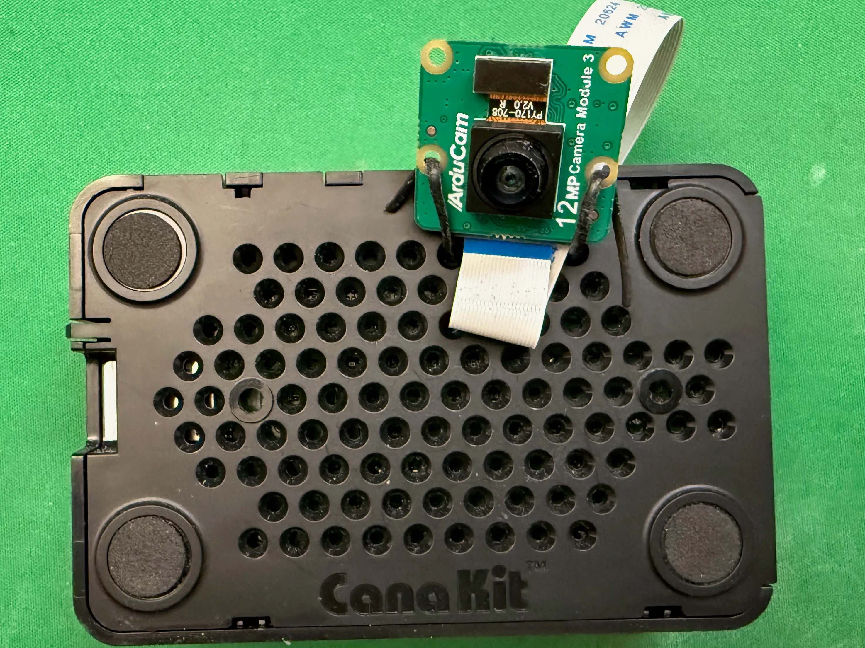 Arducam mounted on the reverse of the case using a plastic twist tie